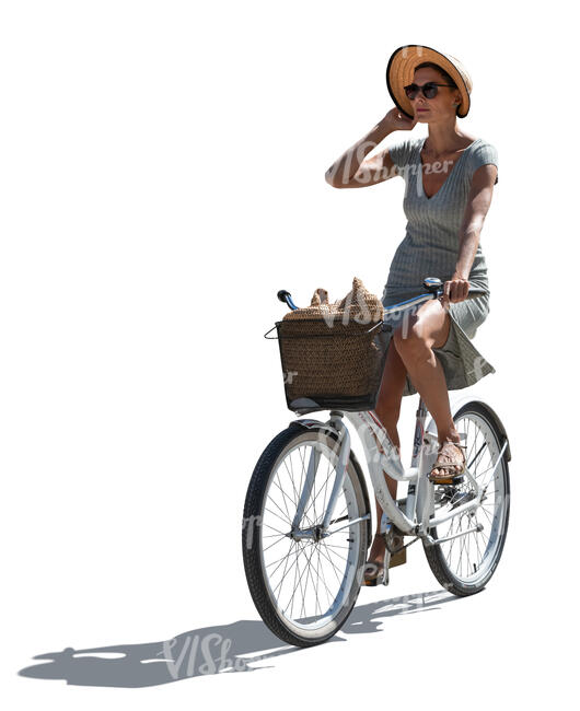 cut out backlit woman with a hat riding a bike