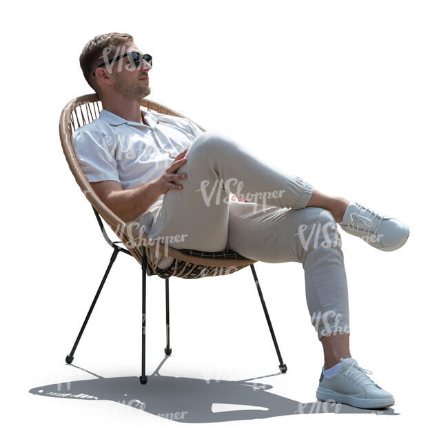 man relaxing in a balcony chair