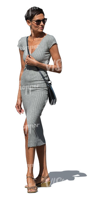 woman in a grey bodycon dress standing