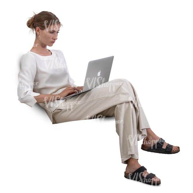 cut out woman sitting on a couch and working with laptop