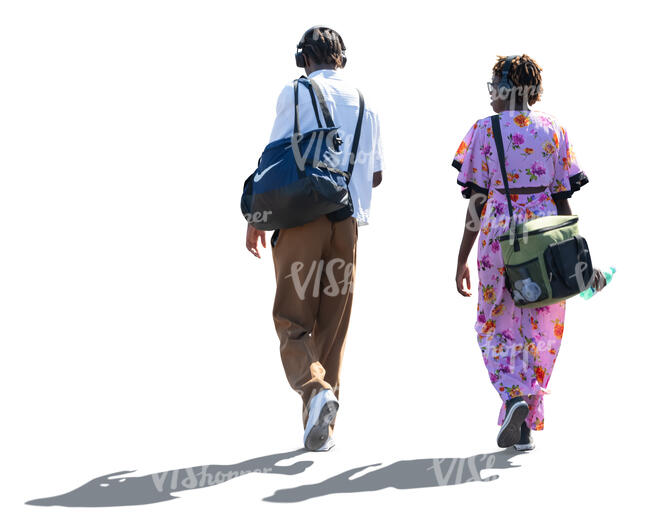 two backlit black people walking