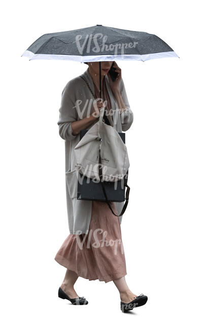 cut out woman with an umbrella walking and talking on a phone