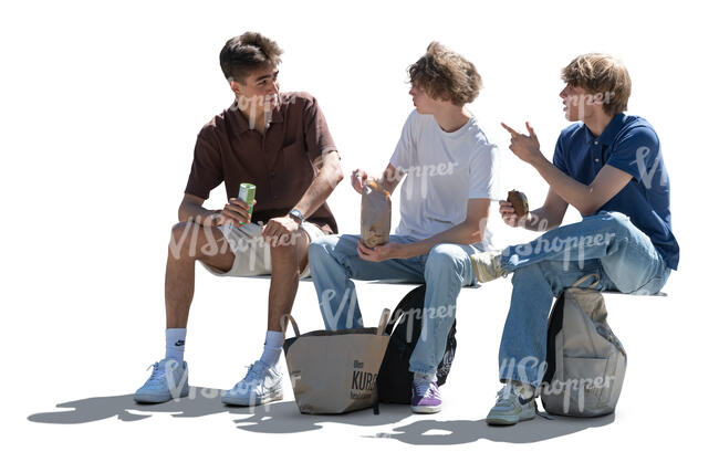 three cut out backlit teenage boys sitting and eating sandwiches