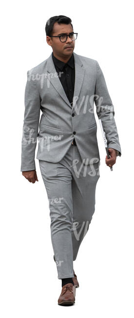 man in a grey suit walking