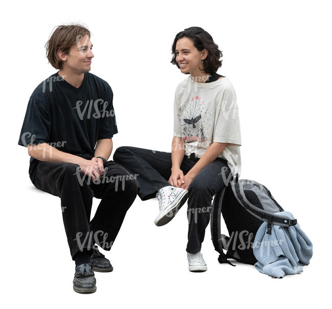 two people sitting and talking