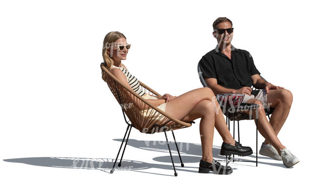 man and woman sitting on balcony chairs outside in the sunlight