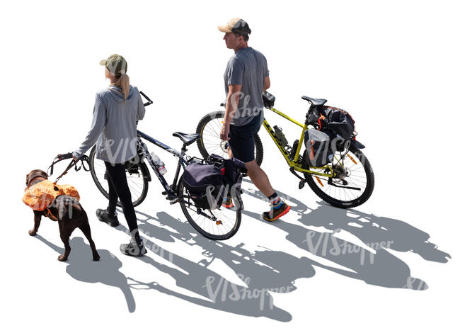 backlit man and a woman with bikes and a dog hiking