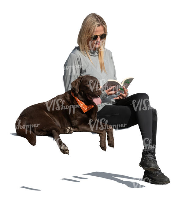 woman with a dog sitting and reading a book