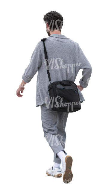 man wearing a grey cardigan walking