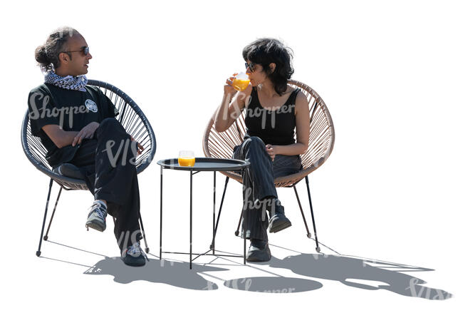 cut out backlit people sitting in an outdoor cafe and talking