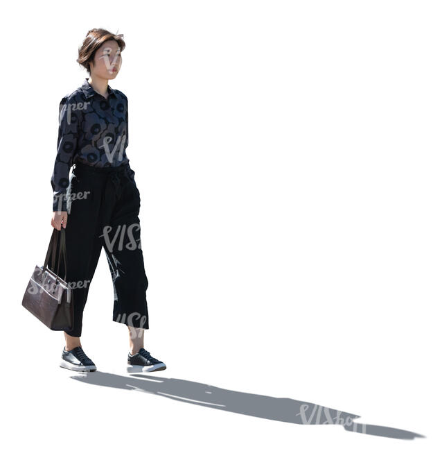 cut out backlit young asian woman walking