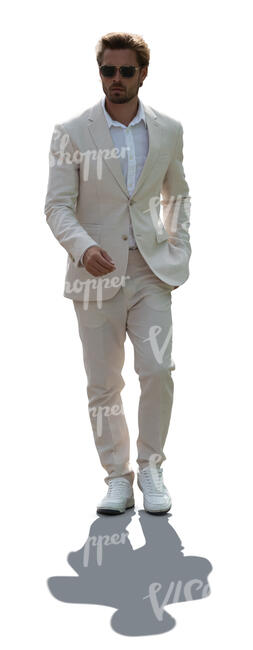 cut out backlit man in a white suit walking