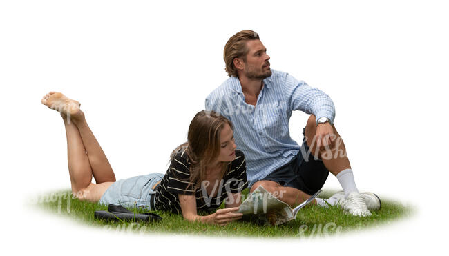 two people sitting and relaxing on the grass