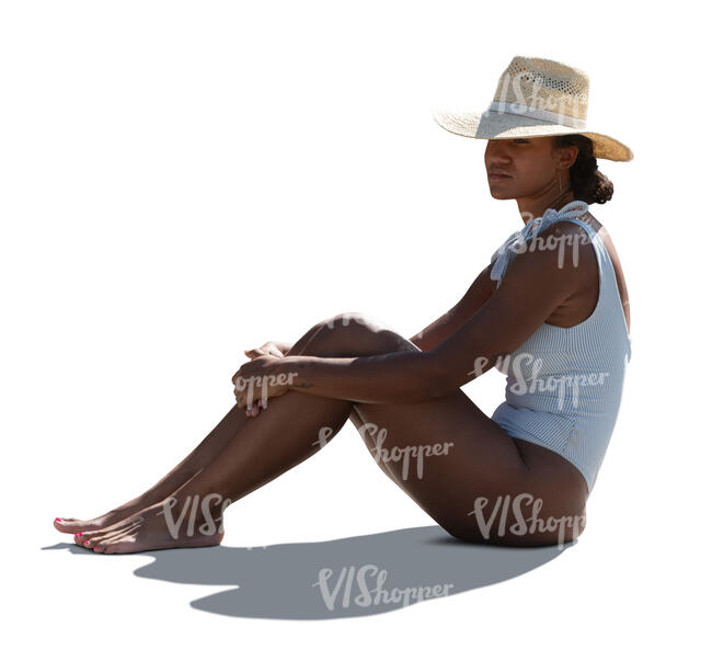 cut out backlit woman in a white swimsuit sitting