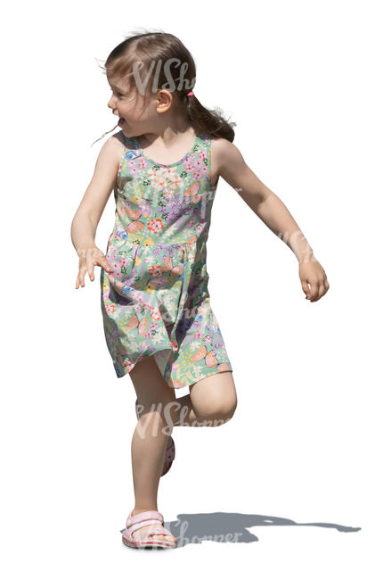 little girl running and looking back over her shoulder