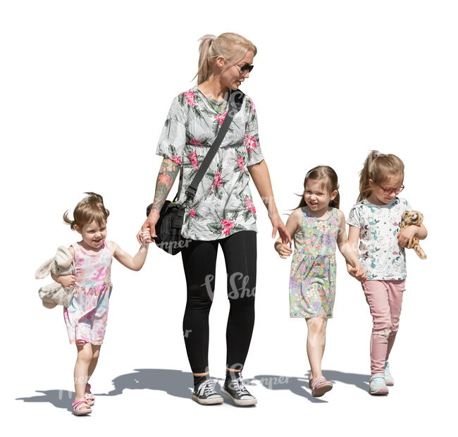 woman with three little girls walking hand in hand