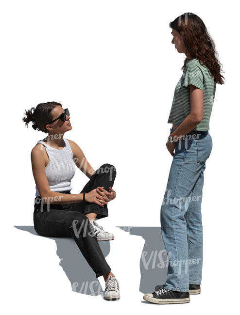 woman standing and talking to her friend