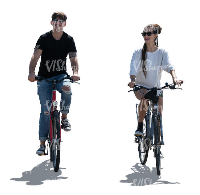 two backlit people riding bikes