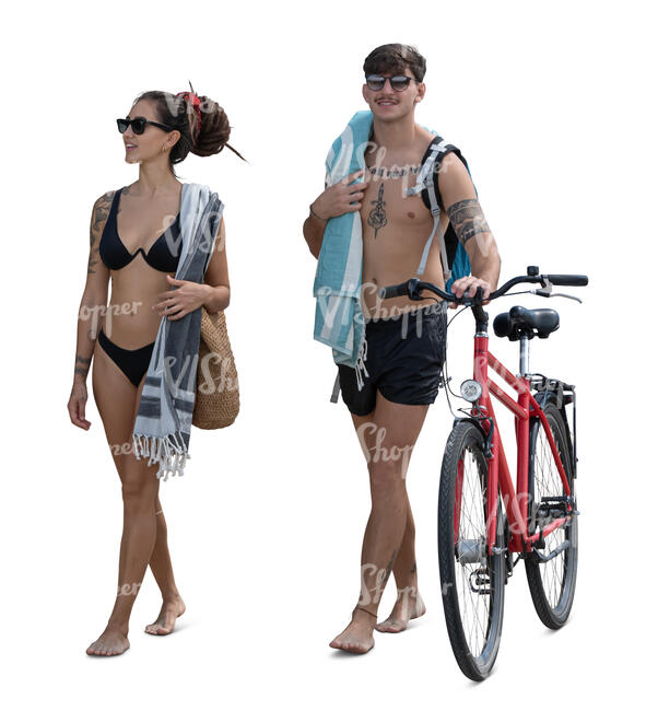 two people with bike walking on the beach