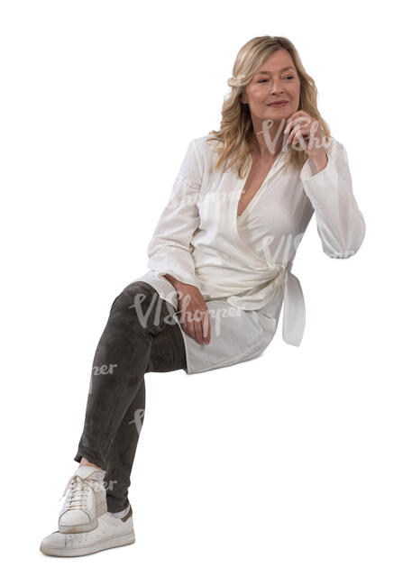 middle aged woman sitting casually on the sofa