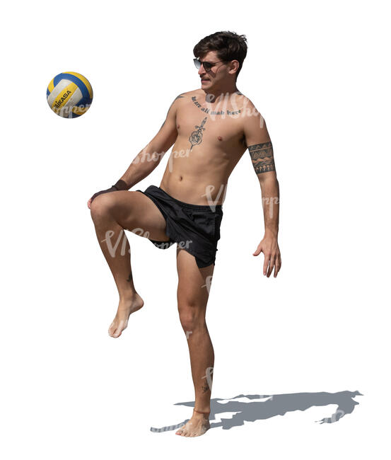 cut out young latino man playing with a football on the beach