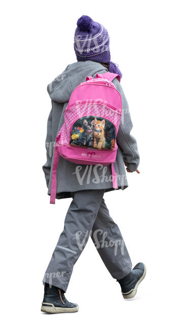 little girl with a school bag walking in autumn