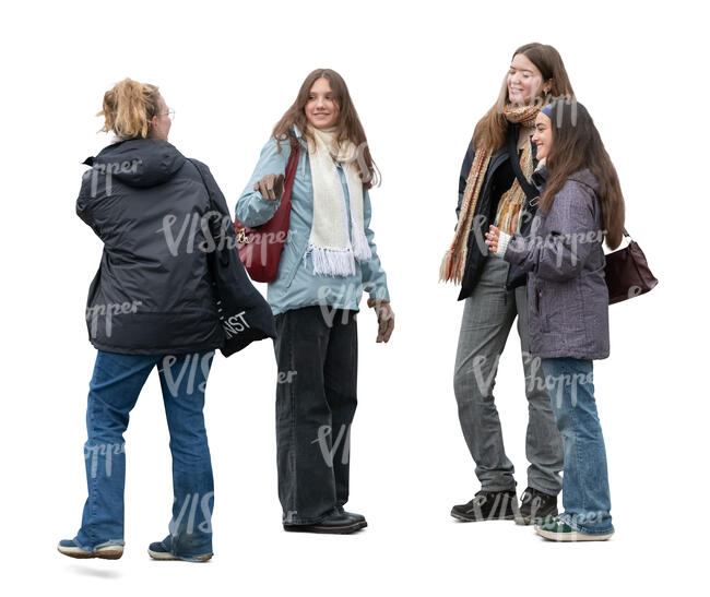 four young women standing outside and talking