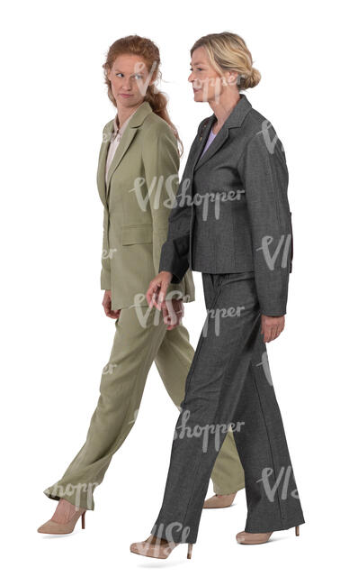 two women wearing business suits walking