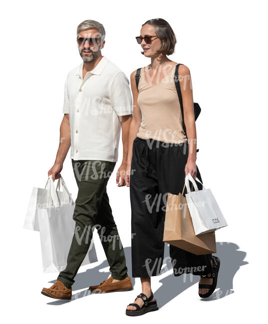 man and woman with fancy shopping bags walking