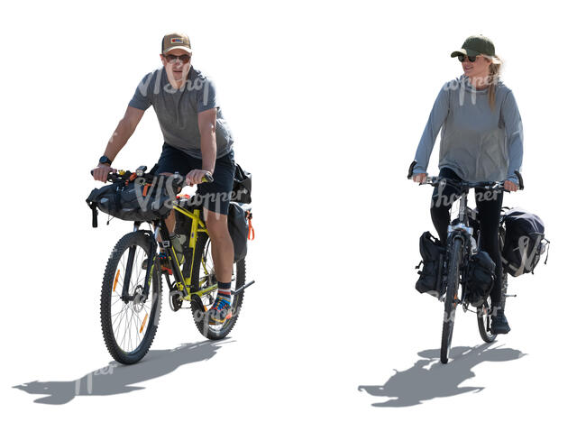 two backlit bikers with travel bags