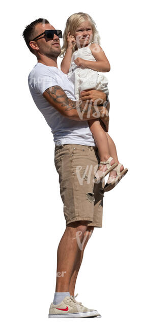 man holding his daughter and standing on a balcony