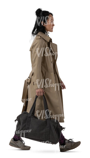 asian woman in a trenchcoat walking