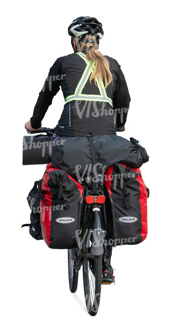 woman riding a travel bike with many bags