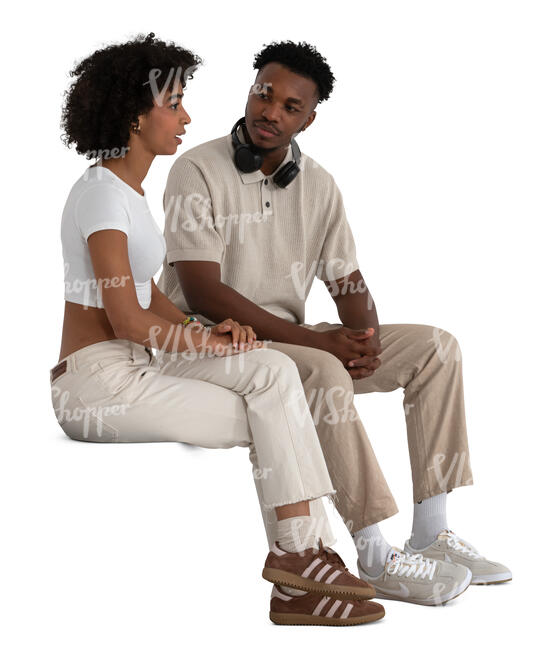 two black people sitting and talking