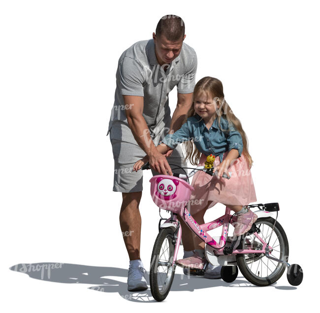 father helping her daughter ride a bicycle