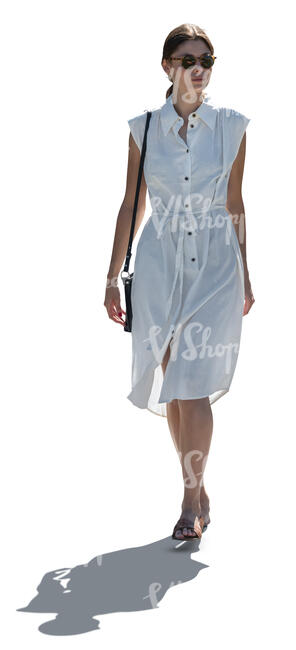 cut out backlit woman in a classy white dress walking