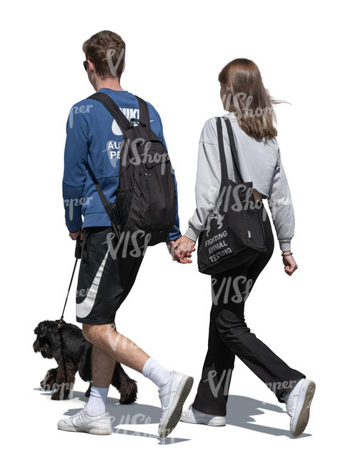 young couple with a dog walking