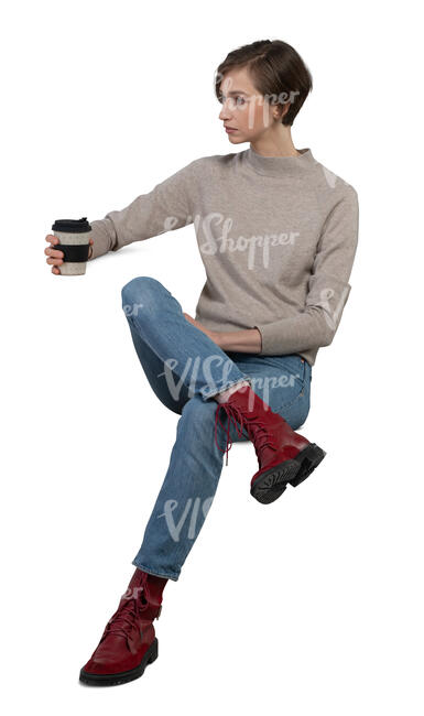 cut out woman sitting by the table and drinking coffee