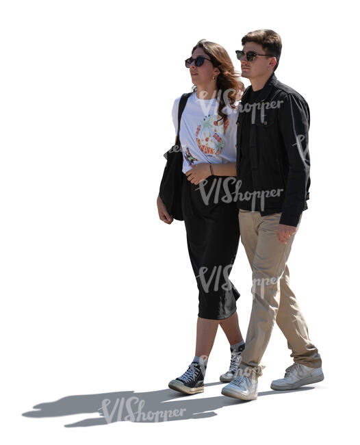 cut out backlit couple walking in the street