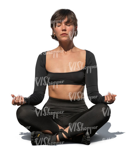 cut out woman sitting in a yoga pose outside