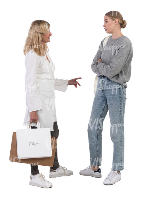 two women standing and talking while shopping