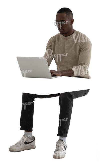 cut out black man sitting and working with a computer