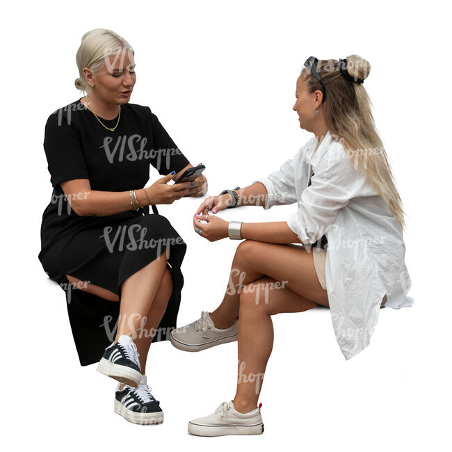 two women sitting and talking