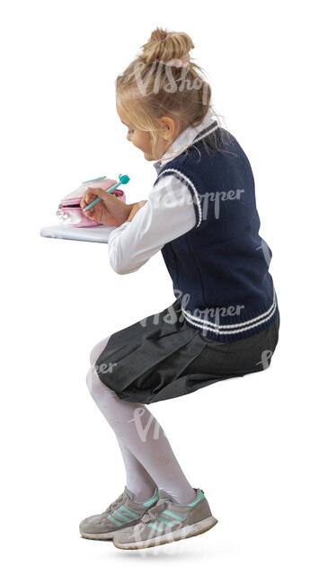 cut out schoolgirl sitting and writing