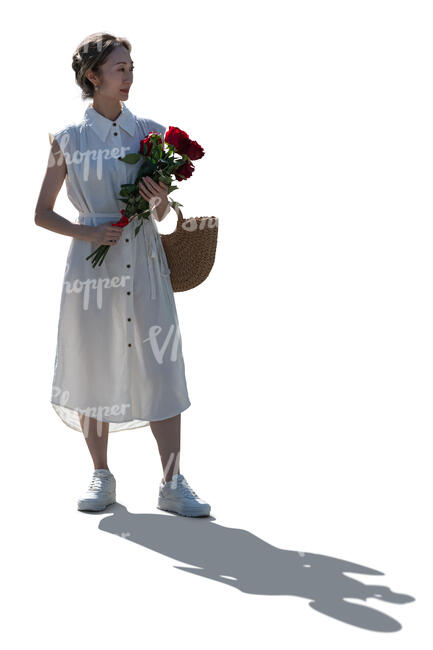 backlit woman with a bouquet of roses standing