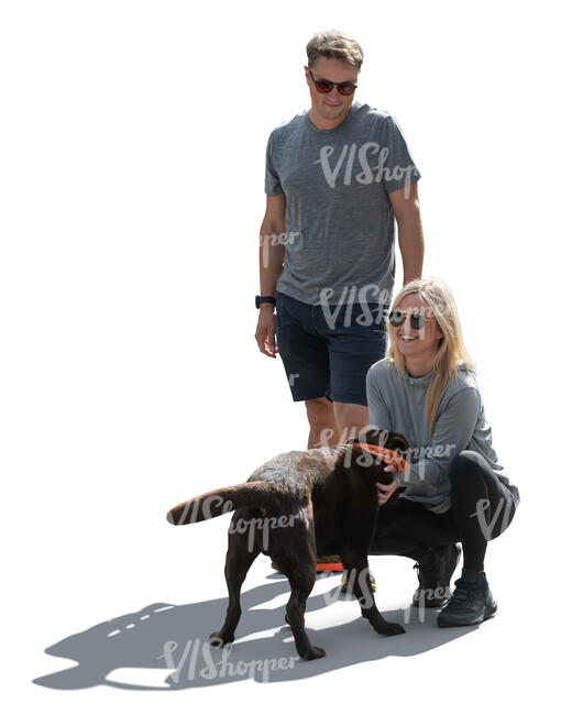 cut out backlit couple with a dog standing