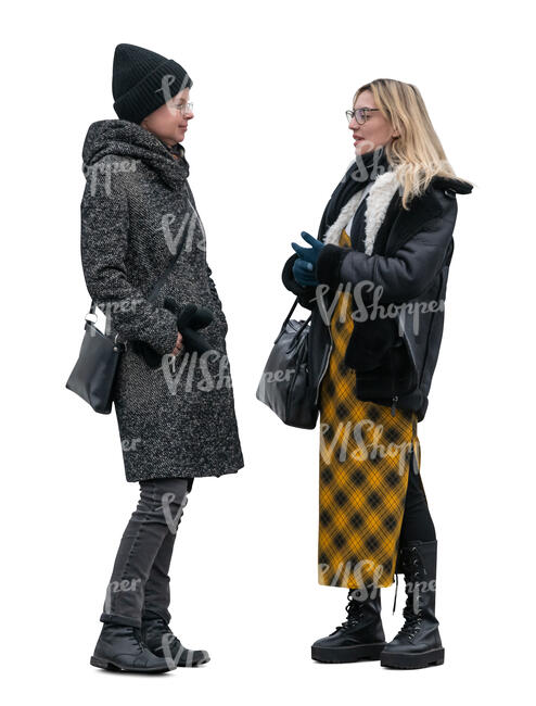 two women standing outside and talking