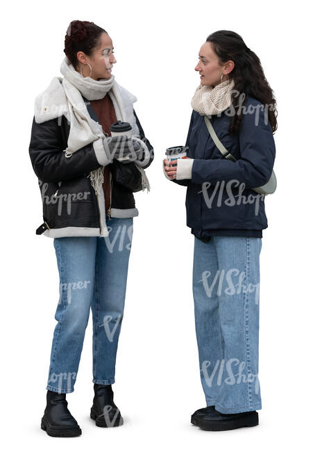 two girls in winter standing and drinking coffee