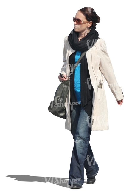 woman wearing a spring coat walking - VIShopper