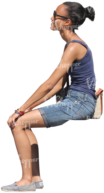 black woman in denim shorts sitting